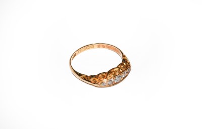 Lot 36 - An 18 carat gold diamond five stone ring,...