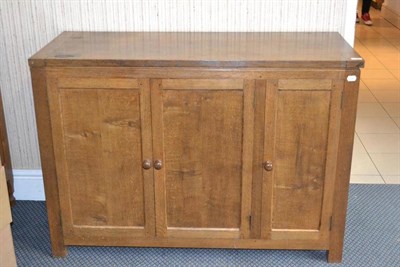 Lot 989 - A David  "Oak Leaf " Langstaff Panelled Oak Serving Unit, with hinged top, above three cupboard...