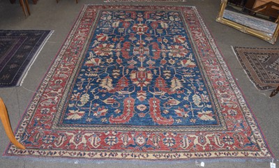 Lot 1221 - An Afghan carpet of Heriz design, the indigo...