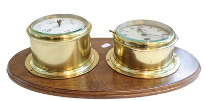 Lot 238 - A brass ships bulkhead timepiece and aneroid...