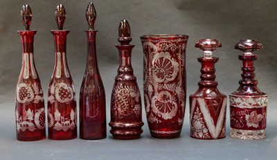 Lot 99 - Six Bohemian ruby flashed decanters and...