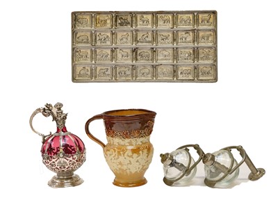 Lot 101 - Cranberry glass and a plated claret jug,...