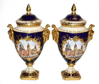 Lot 404 - A pair of Coalport porcelain vases and covers...