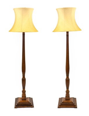 Lot 1333 - A Pair of Early 20th Century Walnut Standard...