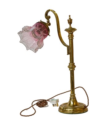 Lot 353 - Victorian brass table lamp with Cranberry...