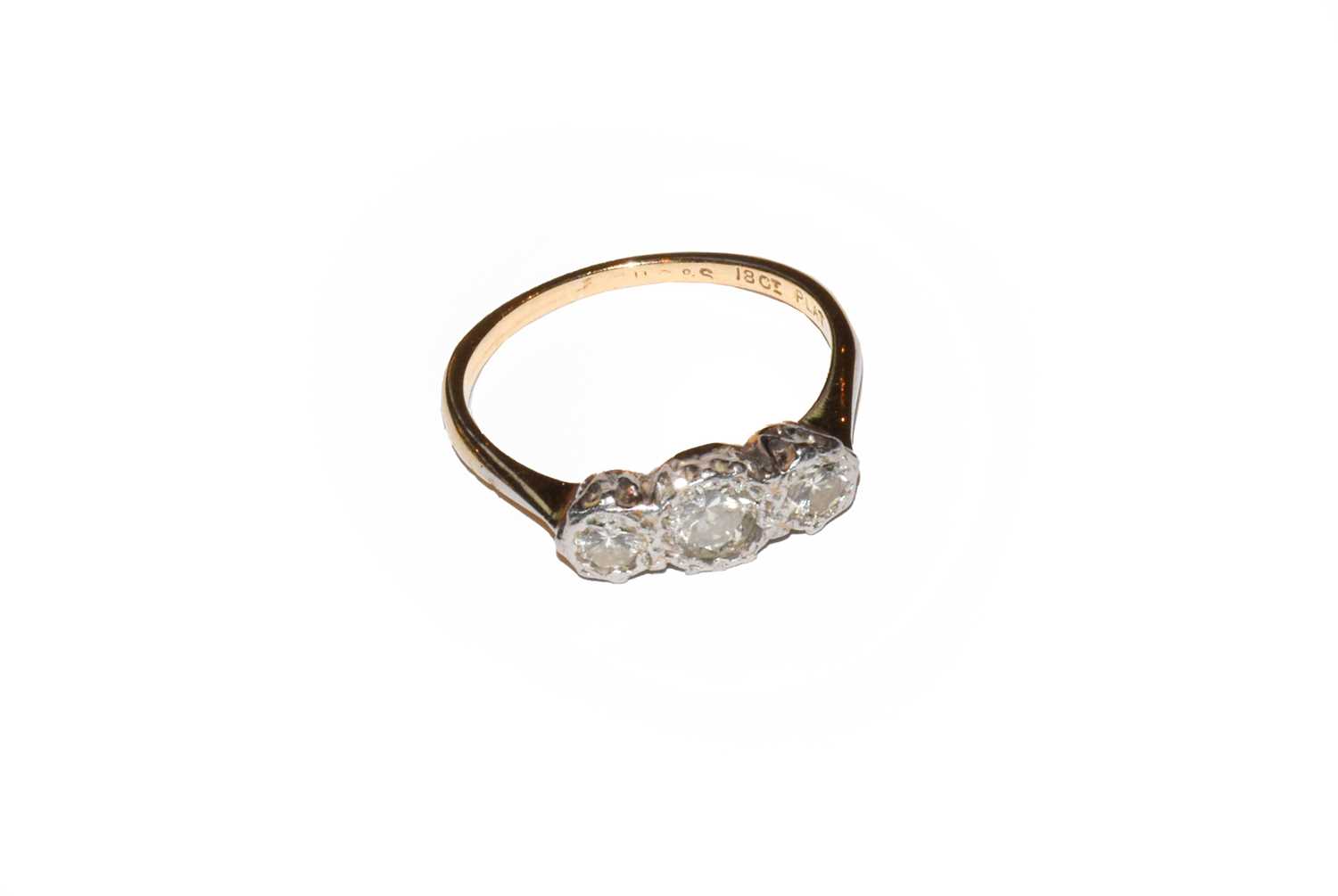 Lot 49 - A diamond three stone ring, stamped '18CT' and...