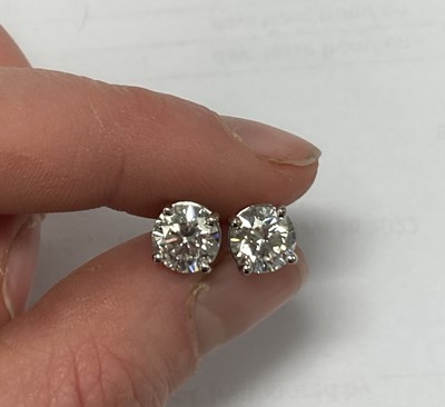 Lot 2415 - A Pair of Diamond Solitaire Earrings