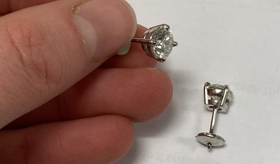 Lot 2415 - A Pair of Diamond Solitaire Earrings