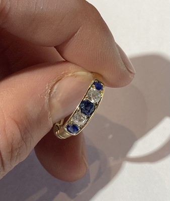 Lot 76 - A sapphire and diamond five stone ring,...
