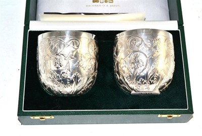 Lot 338 - Pair of silver millennium wine cups made by Richard O A Jarvis, limited edition, numbered 200, in a