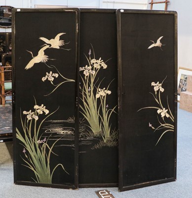 Lot 1427 - An Oriental inspired ebonised four-fold screen,...