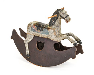 Lot 1334 - A Carved Pine Rocking Horse, painted grey and...