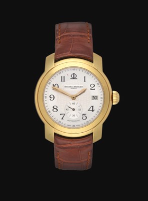 Lot 2100 - Baume & Mercier: An 18 Carat Gold Automatic Calendar Wristwatch