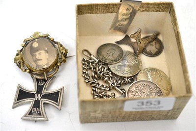 Lot 353 - A silver money clip, a silver albert chain, silver and other coins, reproduction iron cross,...