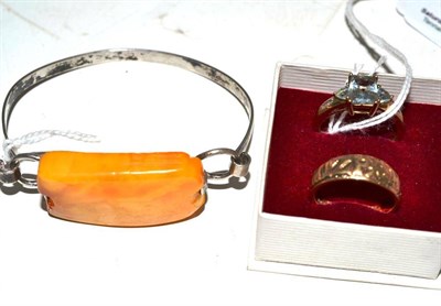 Lot 354 - A 9ct gold aquamarine and diamond ring; a 9ct gold mizpah ring; and an amber bangle stamped...