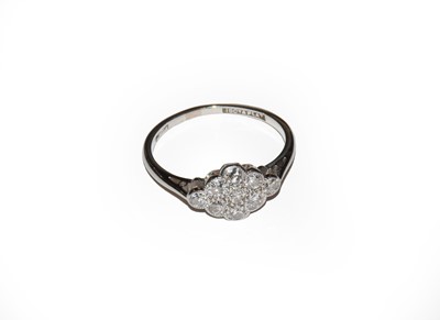 Lot 20 - A diamond cluster ring, stamped '18CT&PLAT',...