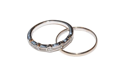 Lot 37 - A platinum diamond half hoop ring, round...