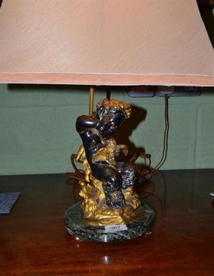 Lot 367 - A bronze and gilt metal table lamp with circular marble base