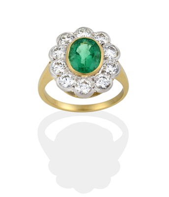 Lot 2322 - An Emerald and Diamond Cluster Ring