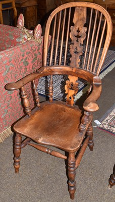 Lot 1315 - A late 19th century, part yew Windsor armchair,...