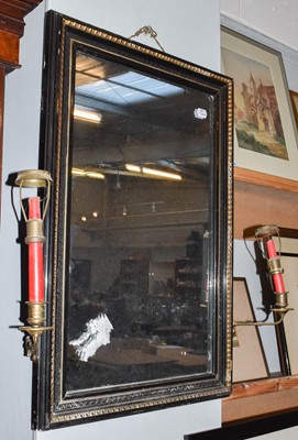 Lot 1240 - ~  An ebonised and parcel gilt girandole wall...