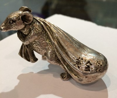 Lot 271 - A Japanese white metal model of a rat carrying...