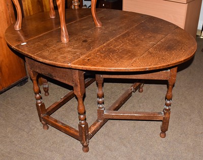 Lot 1338 - An 18th century oak oval gateleg table, 108cm...