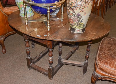 Lot 1292 - An oak 18th century gateleg table, 138cm by...