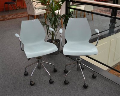 Lot 1004 - A Pair of Kartell Mauri Swivel Chairs, designed by Vico Magistretti, the shell in light blue,...