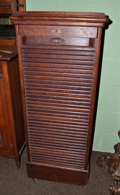 Lot 427 - Oak tambour front cabinet