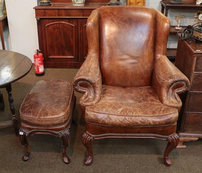 Lot 1294 - A reproduction antique leather armchair and...