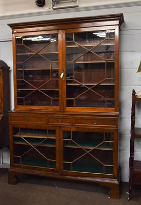 Lot 1252 - A George III style mahogany glazed bookcase,...