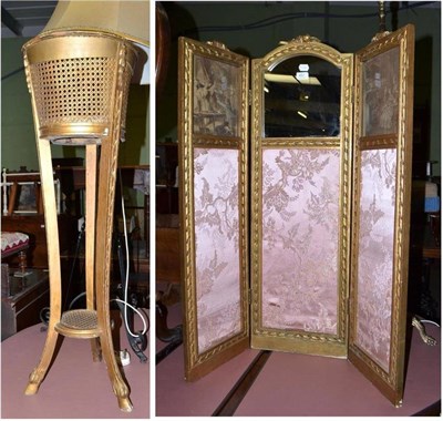 Lot 451 - A three division folding screen and a jardiniere stand with carved cloven feet