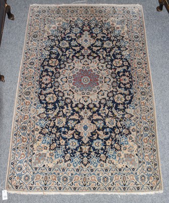 Lot 1224 - A Nain rug, the deep indigo field of palmettes...