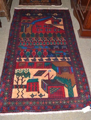 Lot 455 - An Afghan war rug, the field with stylised motifs