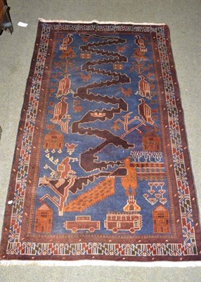 Lot 456 - An Afghan rug, the field depicting war motifs