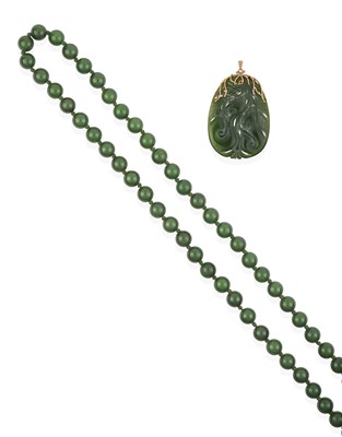 Lot 2347 - A Nephrite Bead Necklace and A Nephrite Pendant