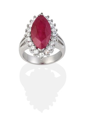 Lot 2046 - A Ruby and Diamond Cluster Ring