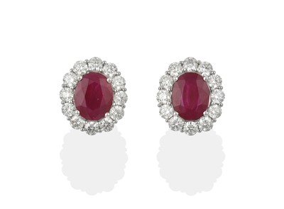 Lot 2041 - A Pair of 18 Carat White Gold Ruby and Diamond Cluster Earrings
