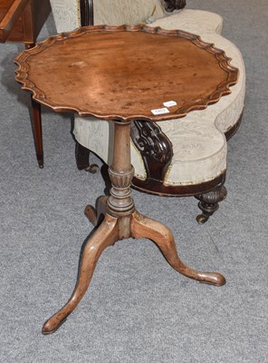 Lot 1453 - A George III style mahogany piecrust top tilt...