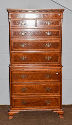 Lot 1257 - A reproduction walnut veneered chest on chest,...