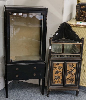 Lot 1422 - ~  An ebonised glazed display cabinet, two...