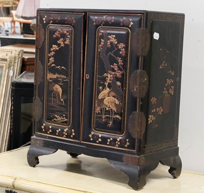 Lot 1448 - ~  A black laquered chinoiserie table cabinet,...