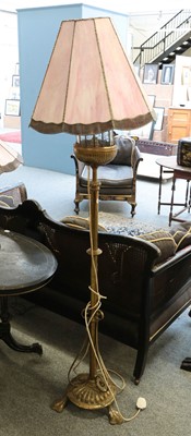 Lot 1451 - ~ A brass telescopic standard lamp with a...