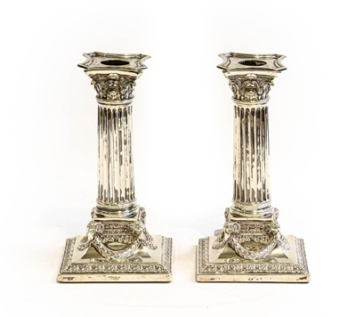 Lot 311 - A pair of late Victorian silver candlesticks...