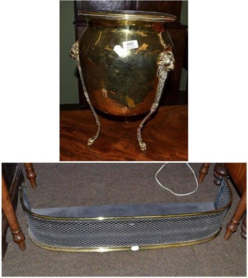 Lot 480 - Brass curb and a brass planter with lion mask handles