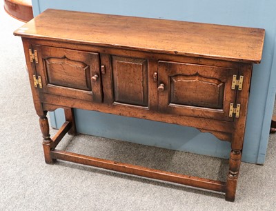 Lot 1437 - A Titchmarsh & Goodwin style oak two door side...