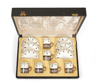 Lot 2146 - A Cased Set of Six George V Silver-Mounted Porcelain Cups and Saucers