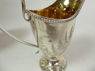 Lot 2193 - A Victorian Silver Cream-Jug, Sugar-Bowl and Ladle