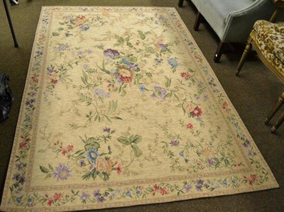 Lot 494 - Europe machine made carpet, the corn field of naturalistic splays enclosed by meandering vine...